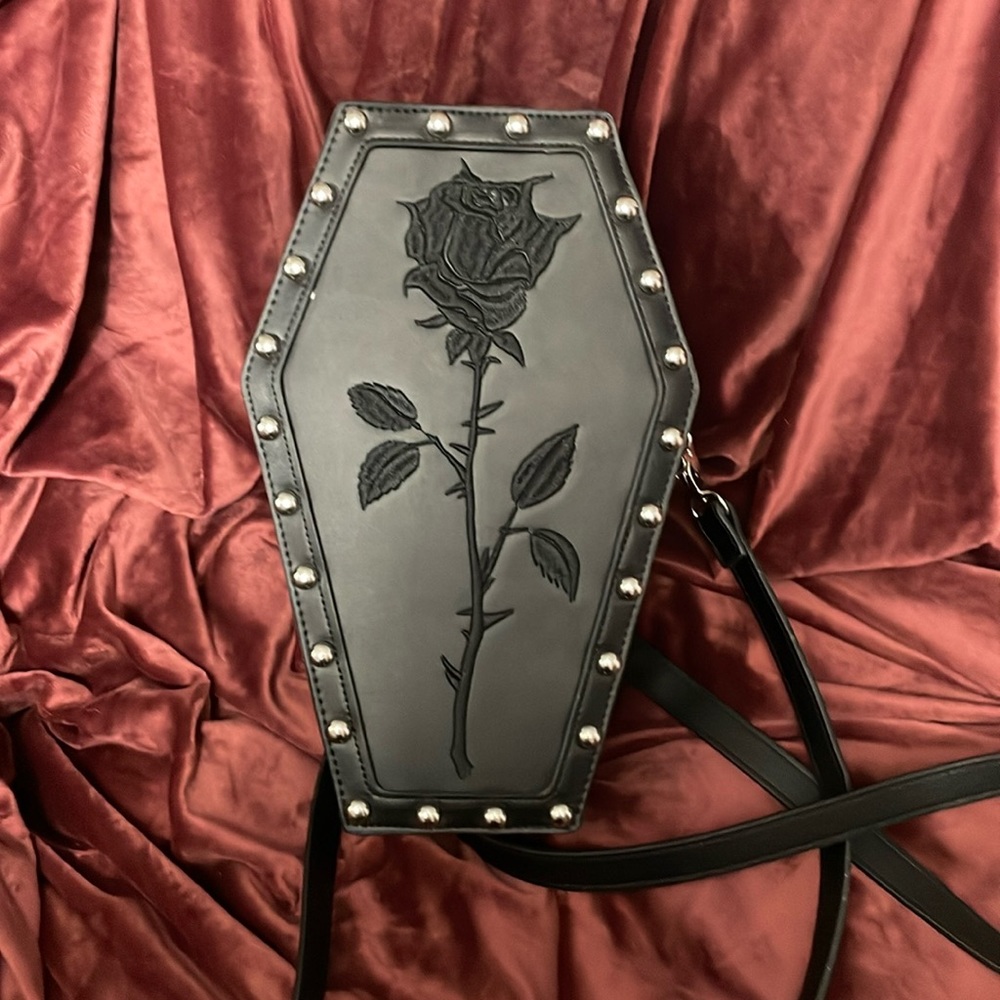 Dolls Kill WIDOW coffin backpack.